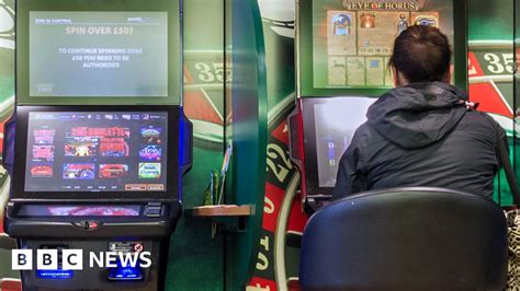Betting machine stakes cut to £2 .
